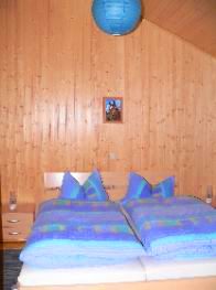 Schlafzimmer mit Doppelbett - Holzhaus / Ferienhaus im Naturpark Oberpflzer Wald 
